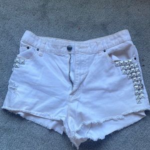 BDG white high waisted jean shorts with spike detail